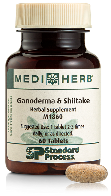 A bottle of Ganoderma & Shiitake herbal supplement next to a tablet.